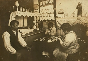 Cardinale family making silk flowers. Father wears a cast. D Cardinale family making silk flowers. Father wears a cast. D