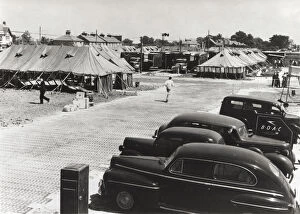 Airports Gallery: Cars Parked and Tents Used As Terminal Buildings with a ?