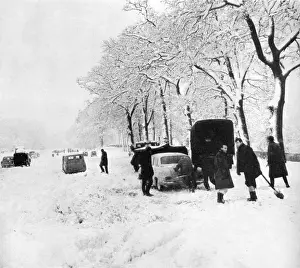 Cars stuck in snow at Pease Pottage, 1963
