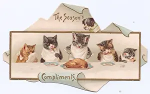Five cats and a dog on a cutout Christmas card