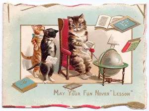 Three cats with globe on a greetings card