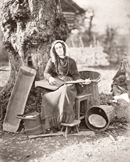 Caucasus Georgia - Georgian woman with a musical instrument