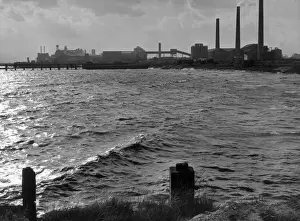 Grays Prints: A cement factory at Grays, Essex, England, seen from the River Thames at high tide in