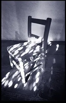 Chair in dappled sunlight