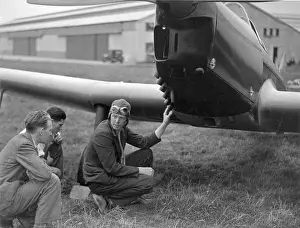Charles A Lindbergh inspects his Miles M12 Mohawk G-AEKW