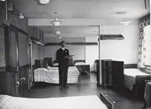 Dormitory Prints: Checking a dormitory at Baden Powell House, London