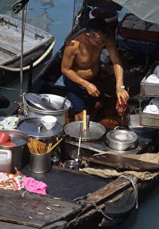 Images Dated 8th August 2019: Chef prepares a Peking Duck - floating restaurant, Hong Kong
