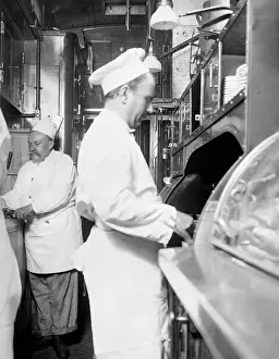 Deluxe Prints: Chefs cooking in the Kitchen on a deluxe overland limited tr