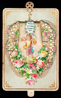Images Dated 14th June 2018: Cherub surrounded by roses on a Christmas card