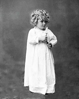 Child with candle ready for bed Victorian period