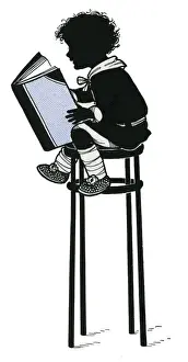 Child reading on a tall stool