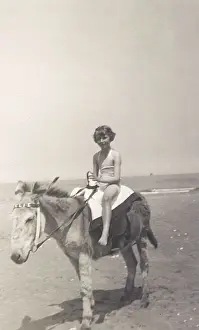 Child riding a seaside donkey
