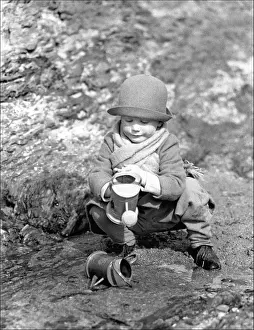Child and watering cans