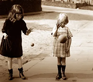 Children bouncing balls, early 1900s