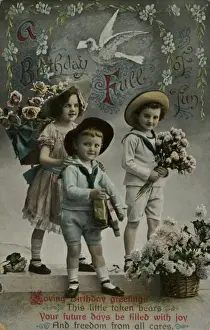 Three children bringing birthday flowers