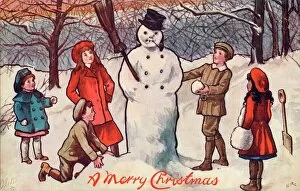 Warm Collection: Five children building a snowman in a wood