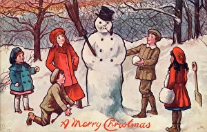 Cold Gallery: Five children building a snowman in a wood