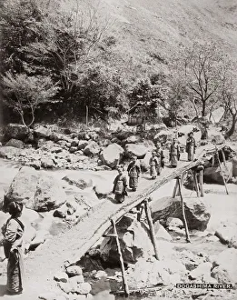 Children crossing the Dogashima River, Japan, c. 1890