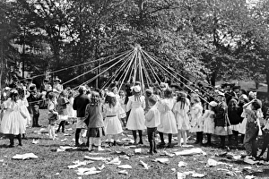 Maypole Gallery: Children dancing around a Maypole in Central Park in New Yor