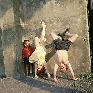 Children doing handstands on a Balham street, SW London