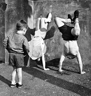 Children doing handstands on a Balham street, SW London