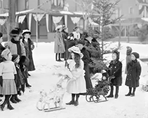 Midwinter Prints: Children with dolls on sleds - Midwinter carnival children s