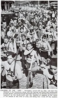 Fist Prints: Children, dressed in Communist jumpers and with toy rifles