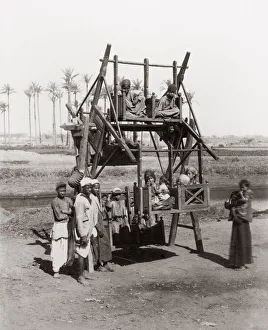 Children on an early funfair ride, Egypt, c. 1890