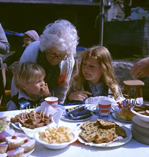 Slices Prints: Children and elderly lady at a street party