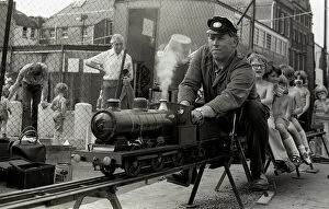 Children enjoy a ride on a model steam train