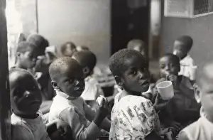 Children with food and drink, Ghana, West Africa