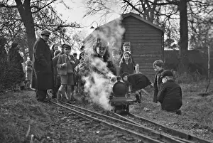 Children gathered around a miniature train