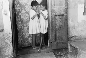 Amalie Prints: Children living in one of the substandard houses on a side s