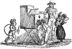 Children looking into a peep box device