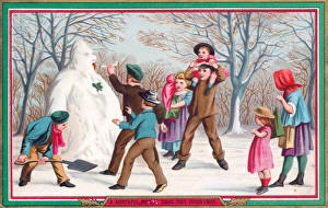 Images Dated 27th October 2015: Children making a snowman on a Christmas card