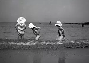 Breaker Gallery: Three children paddling in the sea