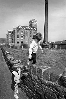Children play outside the old Gannex factory in Elland