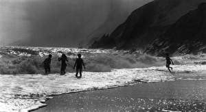 Images Dated 1st March 2012: Children Play in Waves