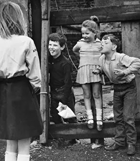 Urchins Prints: Four children playing on a Balham street, SW London