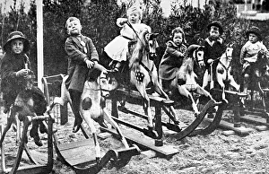Children playing on rocking horses