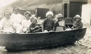 Candid Prints: Children playing in rowing boat on beach at Gorleston-on-Sea