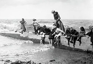 Children playing at the seaside Victorian period
