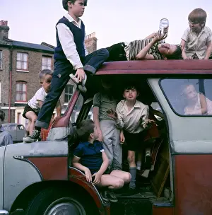 Children playing with a van in a Balham street, SW London