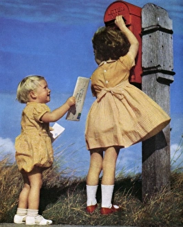 1950s Childhood Gallery: Children posting a letter