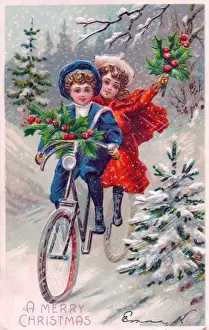 Two children riding a bicycle on a Christmas postcard