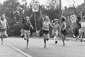 Kites Gallery: Children running along a street with their kites