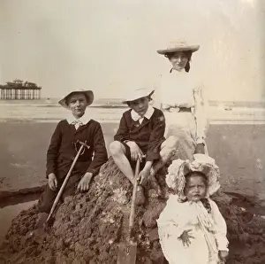 Saltburn Prints: Four children on a sandcastle, Saltburn, North Yorkshire