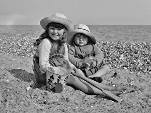 Sunhat Prints: Two children at the seaside