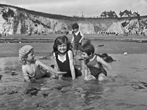 Four children at the seaside