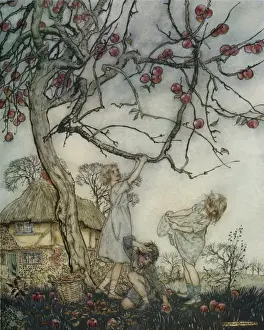 Children shaking apples off a tree